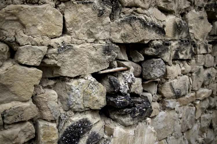 failing retaining wall made of stone